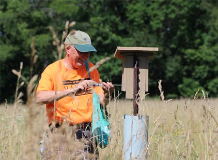 Master Naturalist collecting data about Bluebirds in the field