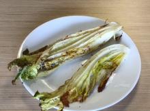 Roasted napa cabbage on white plate