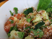 Close up of tabbouleh salad in a white bowl