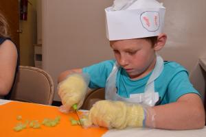 Young boy preparing food
