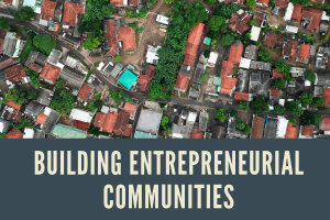 Building Entrepreneurial Communities text over aerial photo of city
