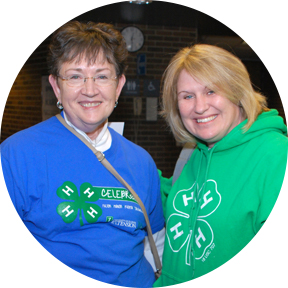 two 4-H volunteers