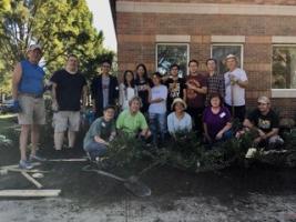 Champaign County Master Gardeners and Chinese Students and Scholars Association volunteers prep the ground for installing the garden.