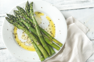 Asparagus on a plate in butter
