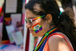 Person with rainbow colored accessories 