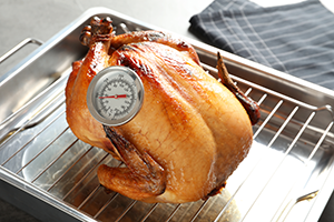 Roasted turkey with meat thermometer inserted