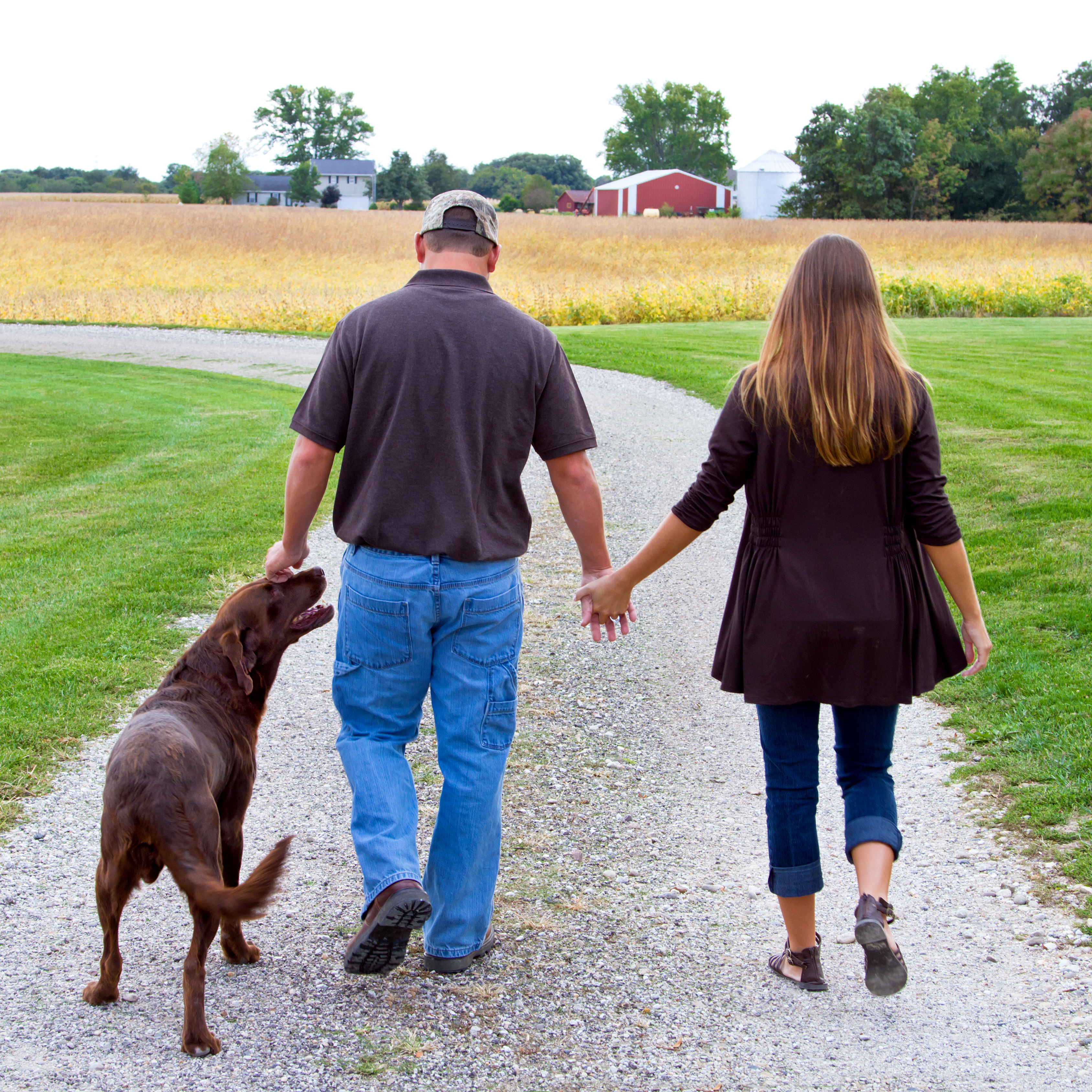 couple walking their dog in the country