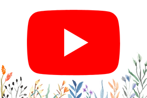 red rectangle with white play button and flowers