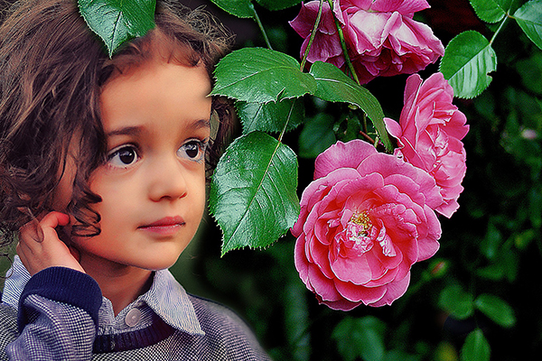 young girl in rose garden