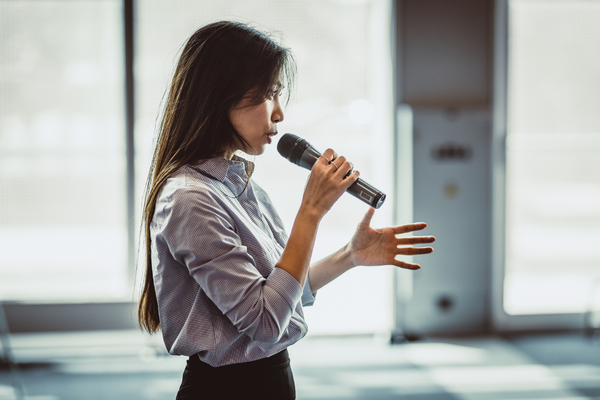 Woman talking into microphone