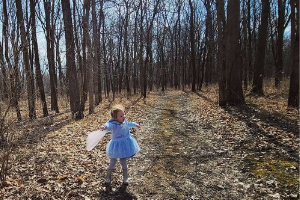 Little girl in the woods
