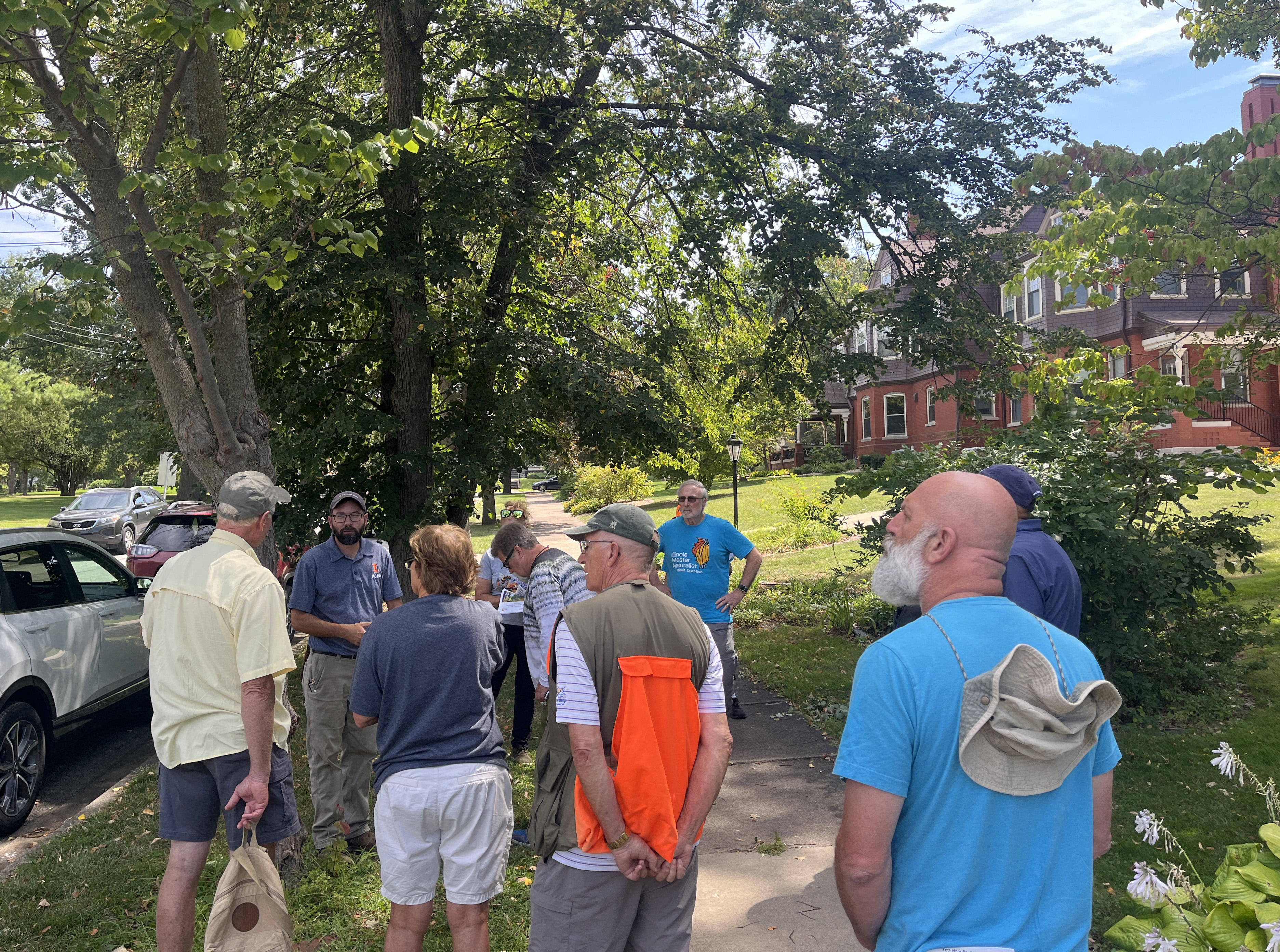 group of volunteers learn about tree health