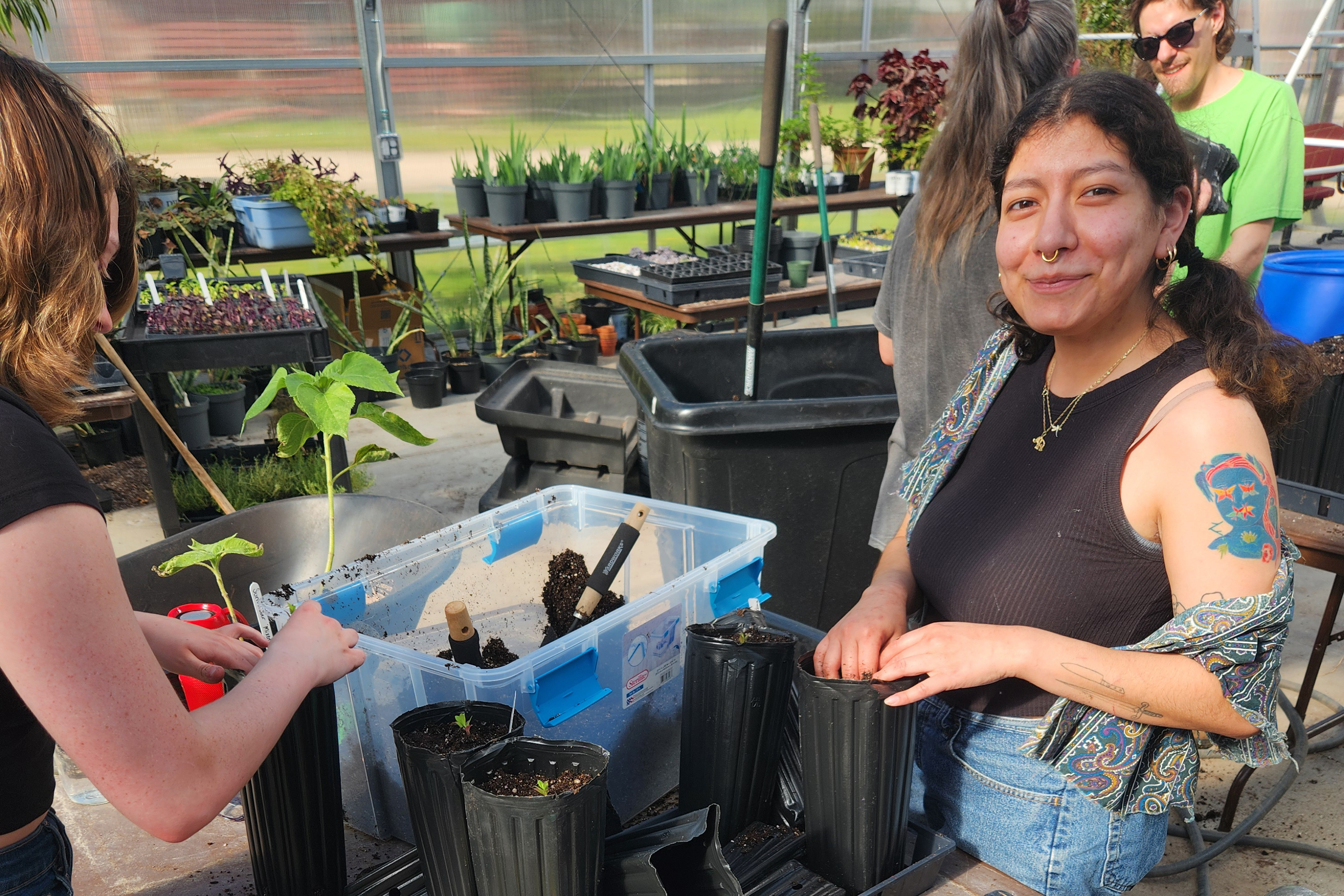 a woman in a greenhouse