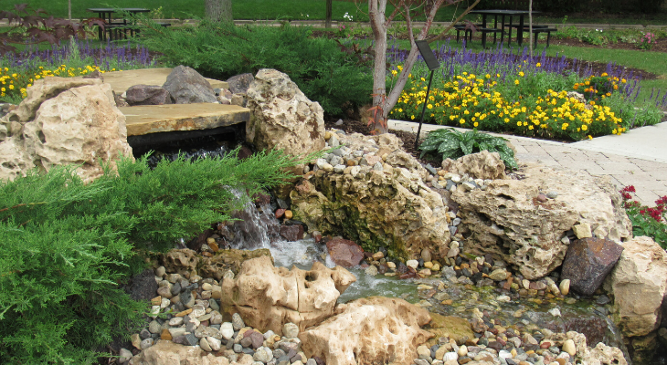 fountain on rocks in garden space