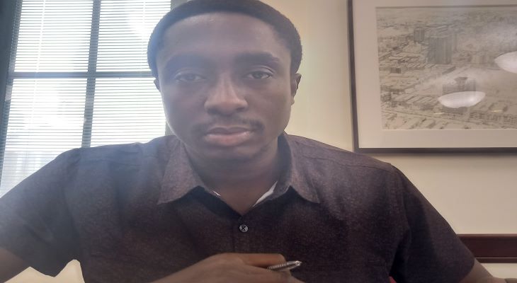 2023 ISPP Scholar Olwakemi Adeyemi sits at his desk