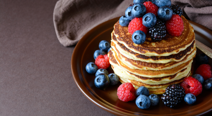 Stack of pancakes with blueberries and raspberries