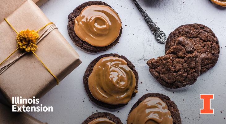 On the left is a brown gift-wrapped box. On the right is four chocolate cookies with peanut butter frosting on a white table. Contains an orange I block logo and Illinois Extension wordmark.
