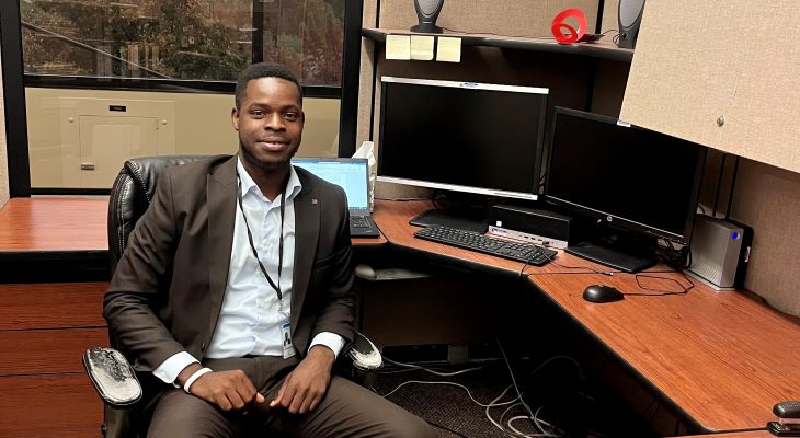 2023 ISPP Scholar Oluwaseun Ojo at his desk at the Illinois Department of Ag