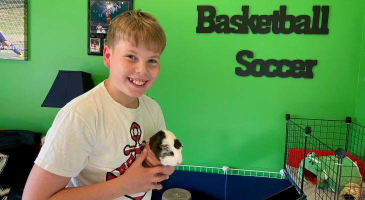 4-H youth holding a Guinea Pig