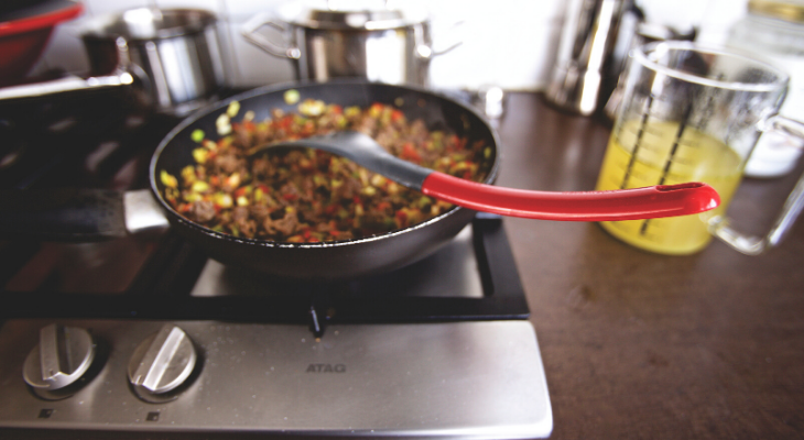 pan with food cooking on a stove