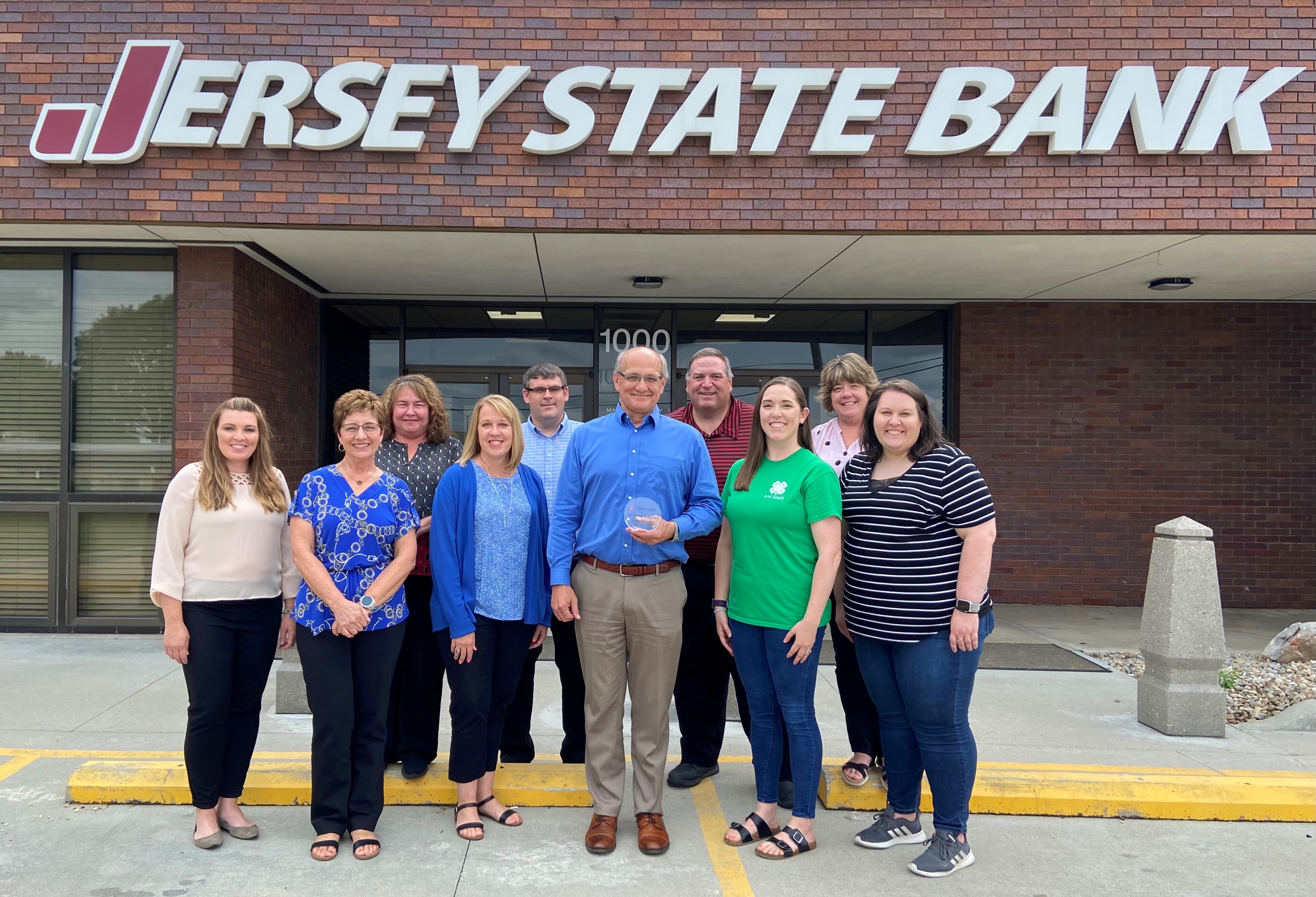 Extension  presenting Jersey State Bank with Community Partner Award