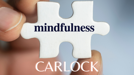 Puzzle piece with mindfulness written on it and the word Carlock listed below