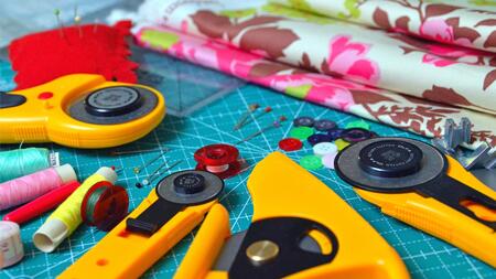sewing tools and colorful fabric