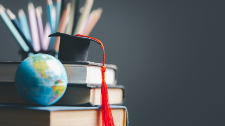 Books and a grad cap.