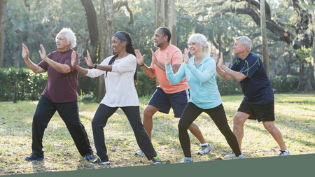 photo of five adults participating in a Tai Chi class