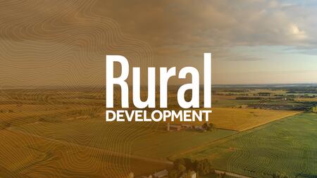 Image of crop fields with the text Rural Development over it.