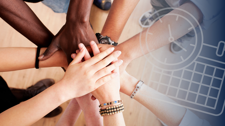 diverse hands in a huddle