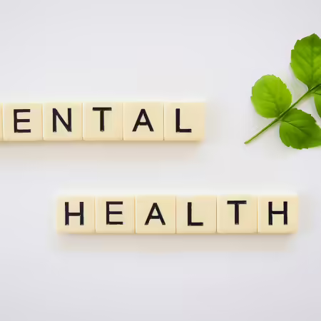 Mental health sign with green leaves