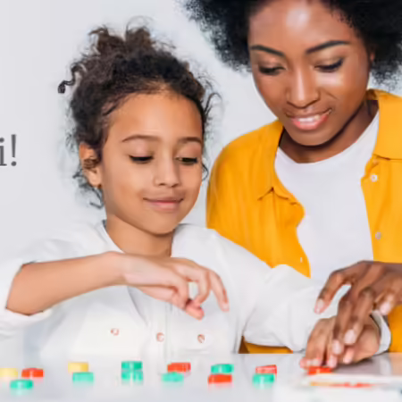 adult woman playing with candy and a little girl