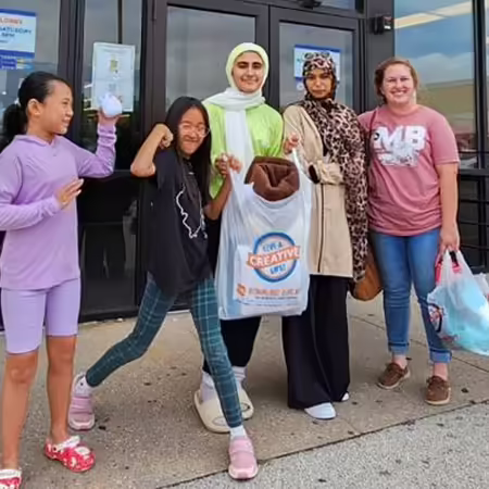 A group of young women with shopping bags