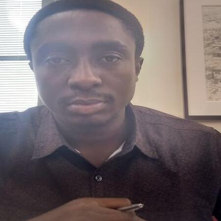 2023 ISPP Scholar Olwakemi Adeyemi sits at his desk
