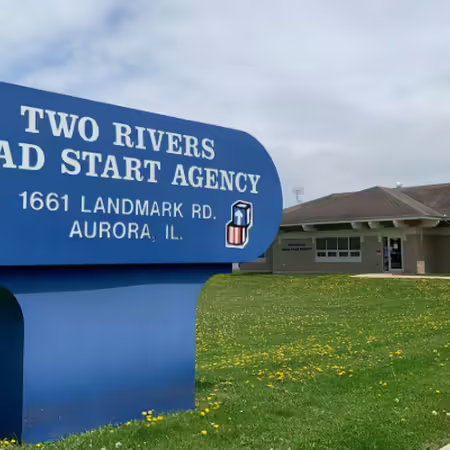 blue two rivers head start sign in front of their building