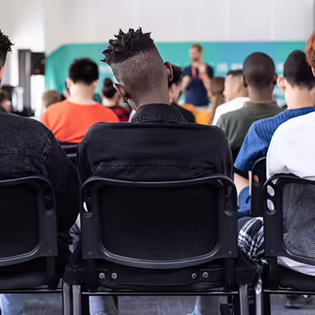 teenagers sitting in classroom