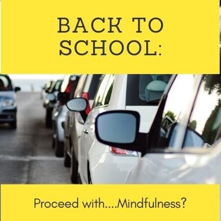 cars lined up on a road with text back to school proceed with mindfulness