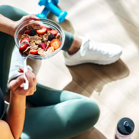girl sitting eating yogurt
