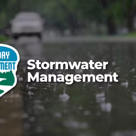 picture of a street with rain drops and text overlay stormwater management