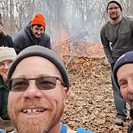 group burning brush in the woods