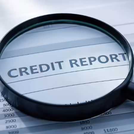Credit report with magnifying glass