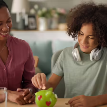 mom and child with piggy bank