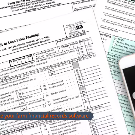 a calculator sitting on top of various farm-related tax forms