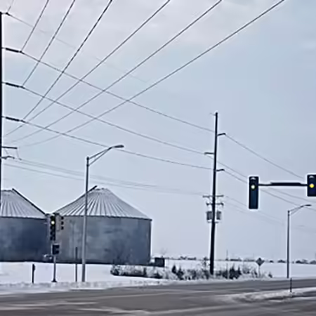 Picture of grain bins near a rural road