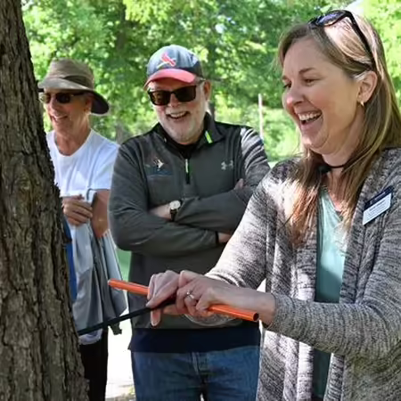 Karen Weigelt using forestry tool