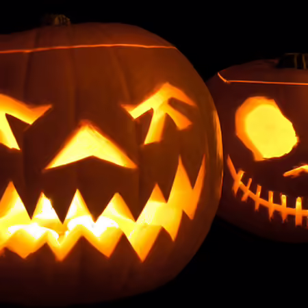 carved jack-o-lantern pumpkins with scary faces