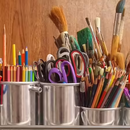 metal bins with art supplies