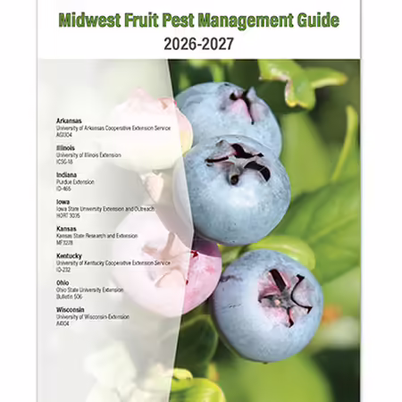A close-up of a blueberry on the cover of a midwest fruit pest management guide publication
