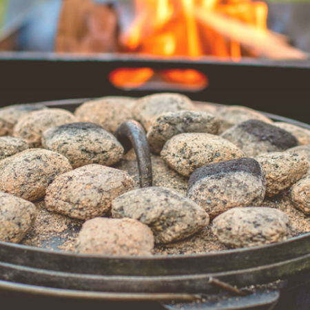 Outdoor Dutch Oven with hot coals on the lid